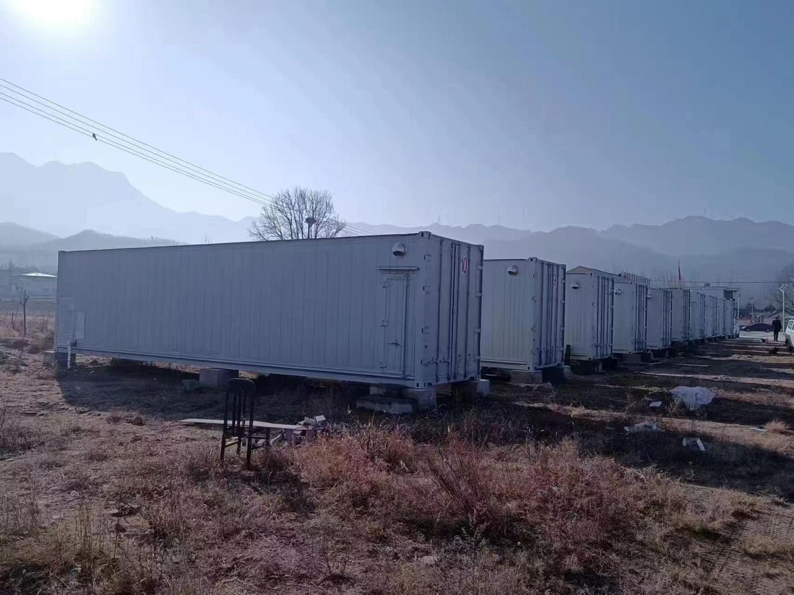 ▲ Cabins installed on elevated foundations, ready to produce once powered